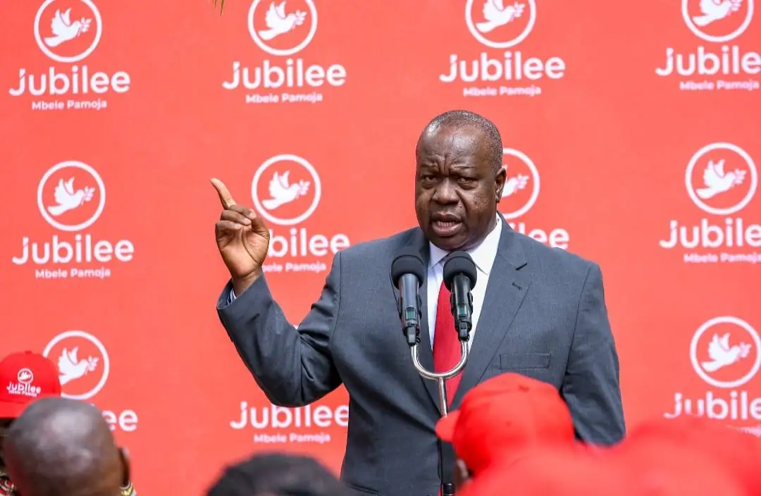 Dr Fred Matiang'i speaking at a podium