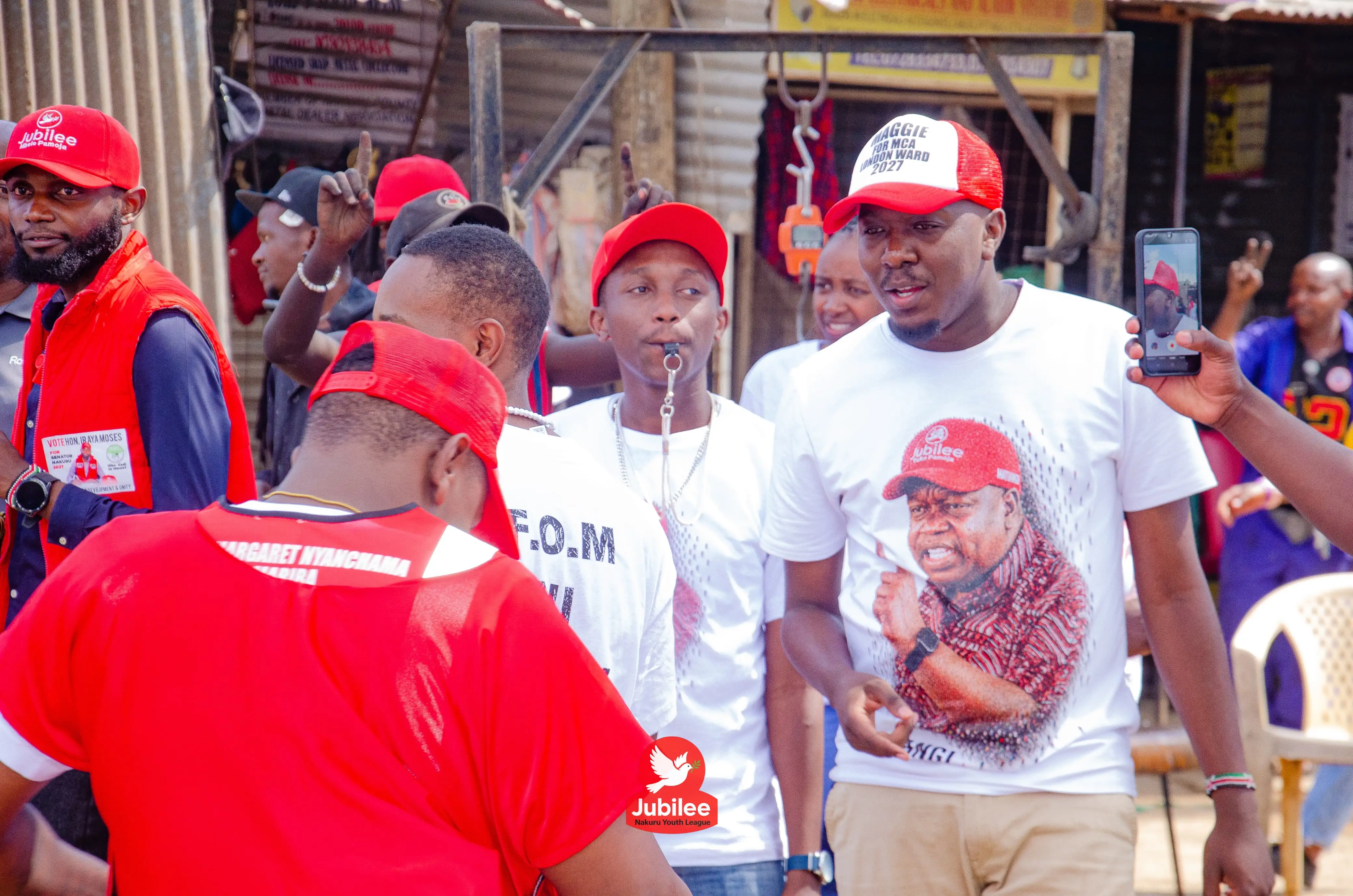 Young men in red and white campaign tees